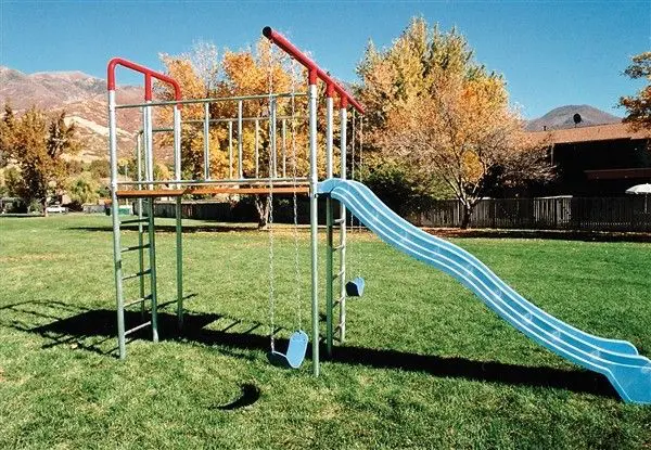 A park with slides and swings equipment